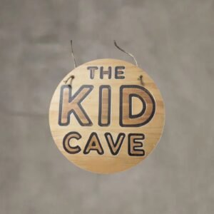 The Kid Cave Sign Printed On Neutral Plywood